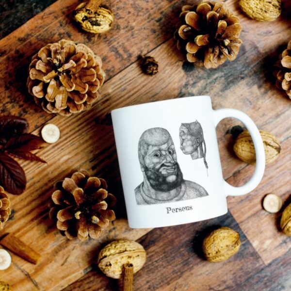 Perseus mug with pinecones and walnuts on table.