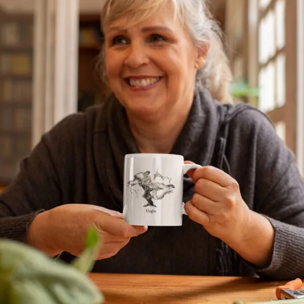 Woman smiling, holding a coffee mug indoors.