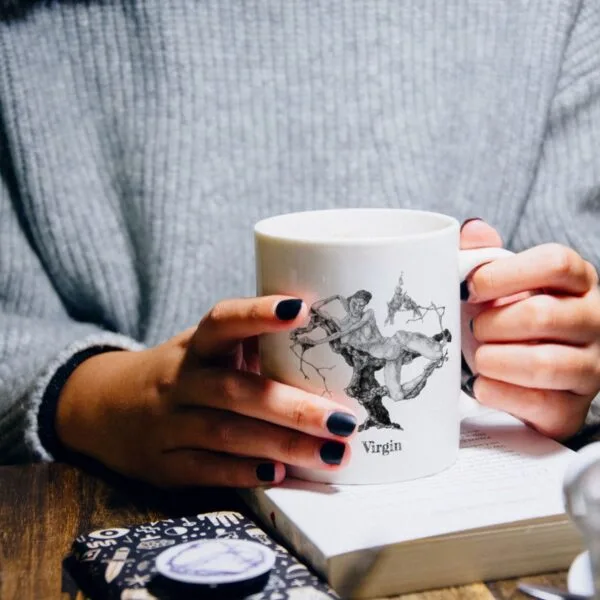 Paul Klee Virgin Design Coffee Mug held by person with book