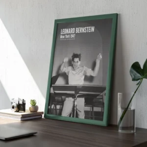 Framed photo of Leonard Bernstein on a desk.