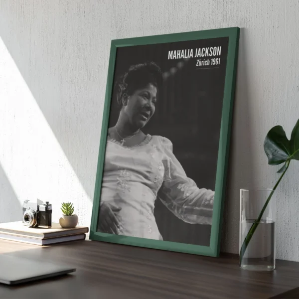Framed photo of Mahalia Jackson on a desk.