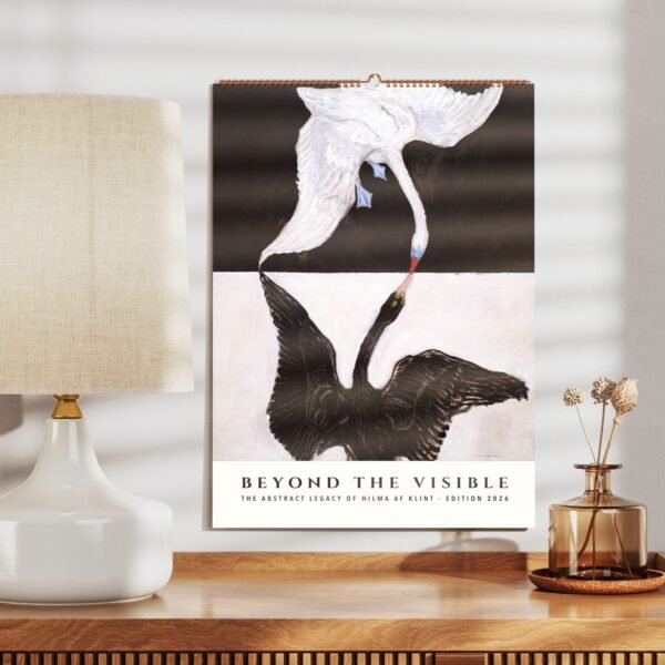 Abstract art poster with swans on a desk.