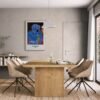 Modern dining room with contemporary art on wall.