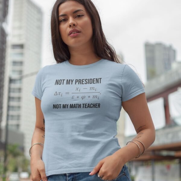 Woman wearing humorous math-themed shirt outdoors.