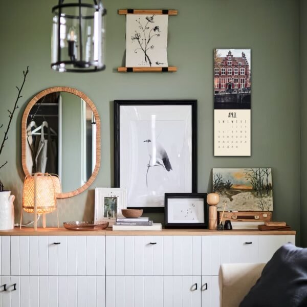 Stylish green room with art and calendar decor.
