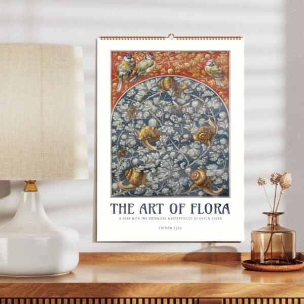 Floral calendar art next to a lamp on table.