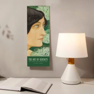 Art calendar on wall, next to lamp and book.
