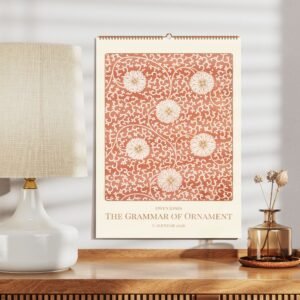 Ornamental calendar 2026 with floral design on table.