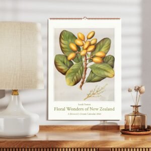 Botanical calendar with lamp on wooden table.