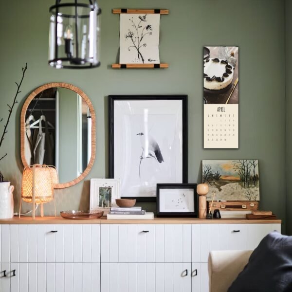 Stylish room with art and calendar on wall.
