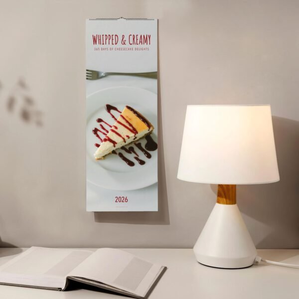 Cheesecake calendar with lamp and open book.