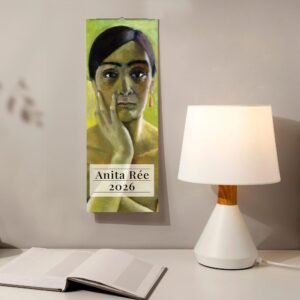 Anita Rée 2026 wall calendar beside lamp and book.