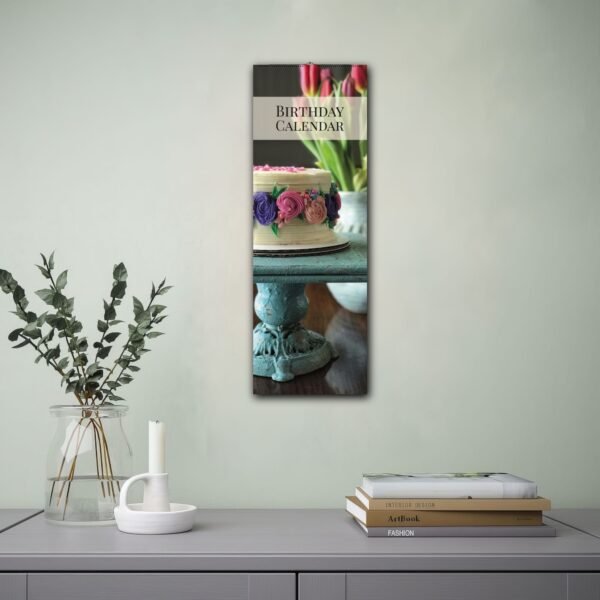 Birthday calendar with cake and tulips on table.