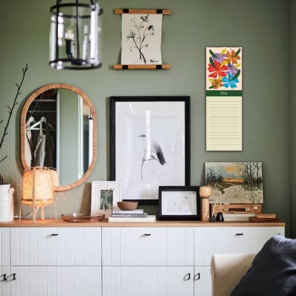Gallery wall with bird and landscape art.