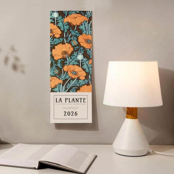 Decorative floral wall calendar beside a modern lamp.