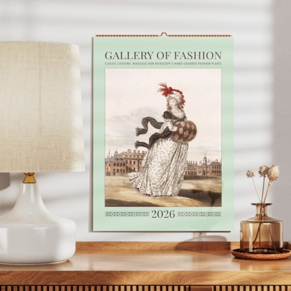 Vintage fashion calendar on wooden shelf, 2026 edition.