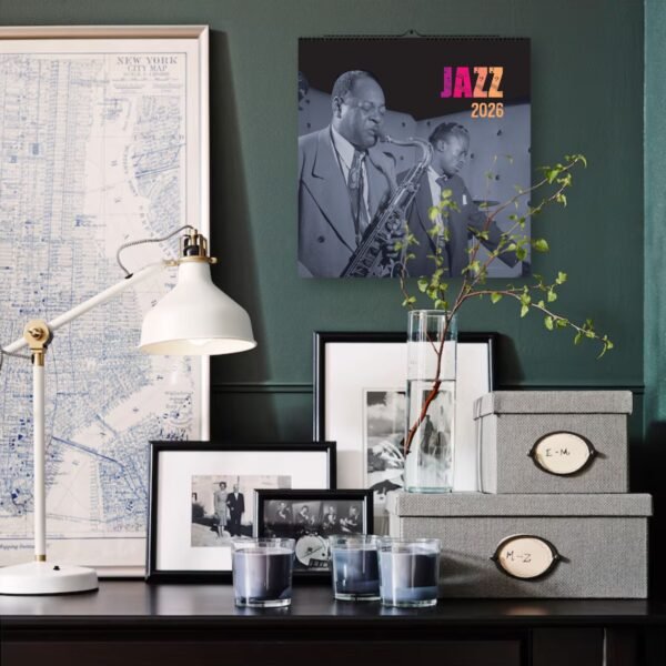 Cozy room with jazz calendar and framed photos.