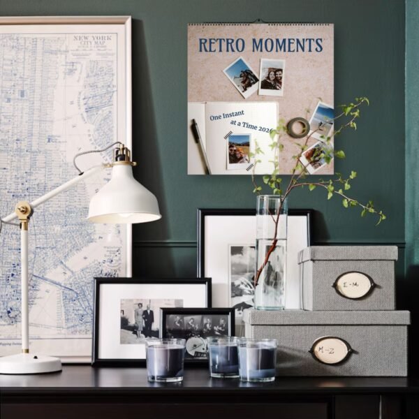 Decorative desk with map, photos, and storage boxes.