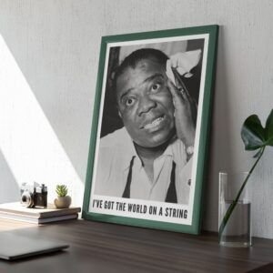 Framed black-and-white portrait on a desk