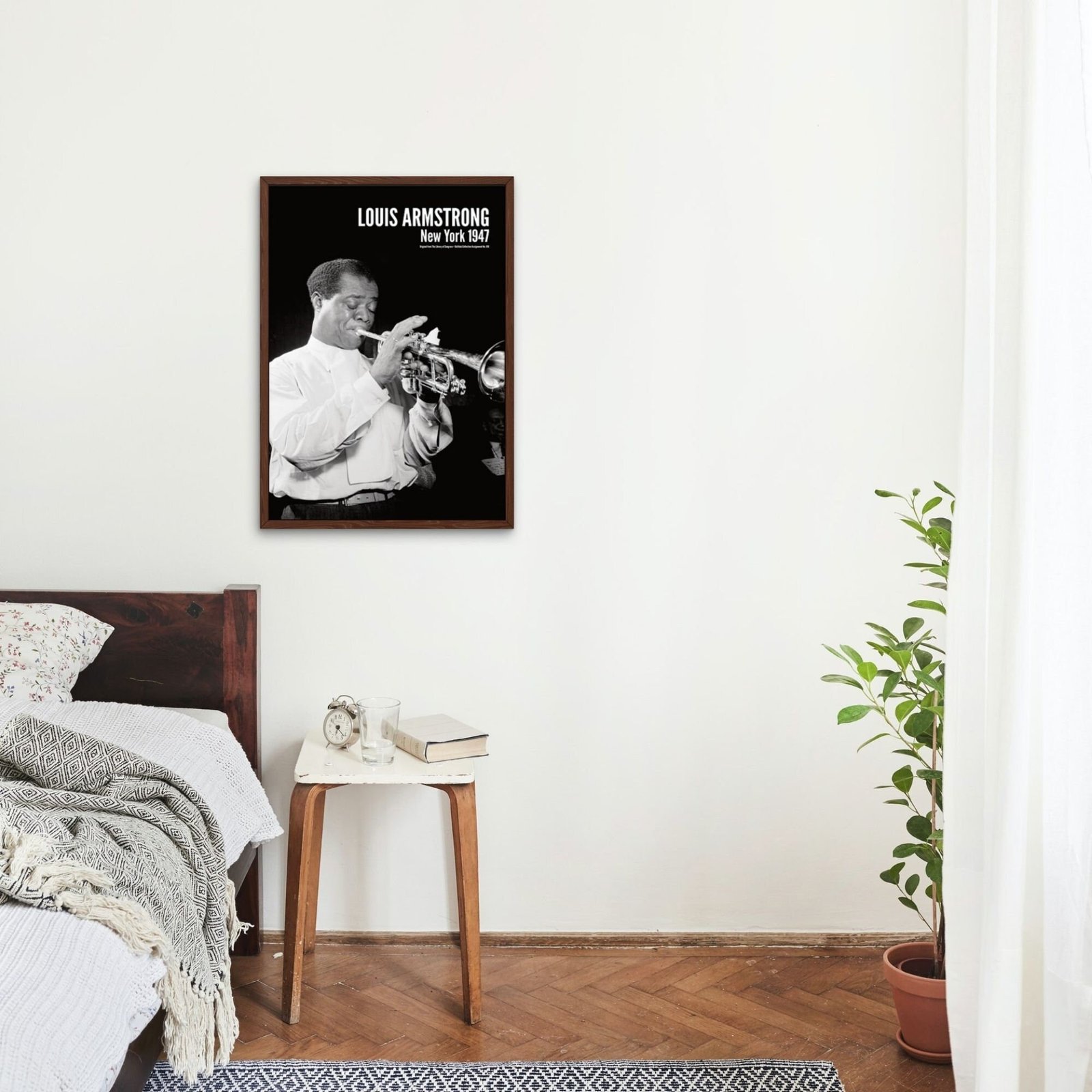 Bedroom with Louis Armstrong poster and plant