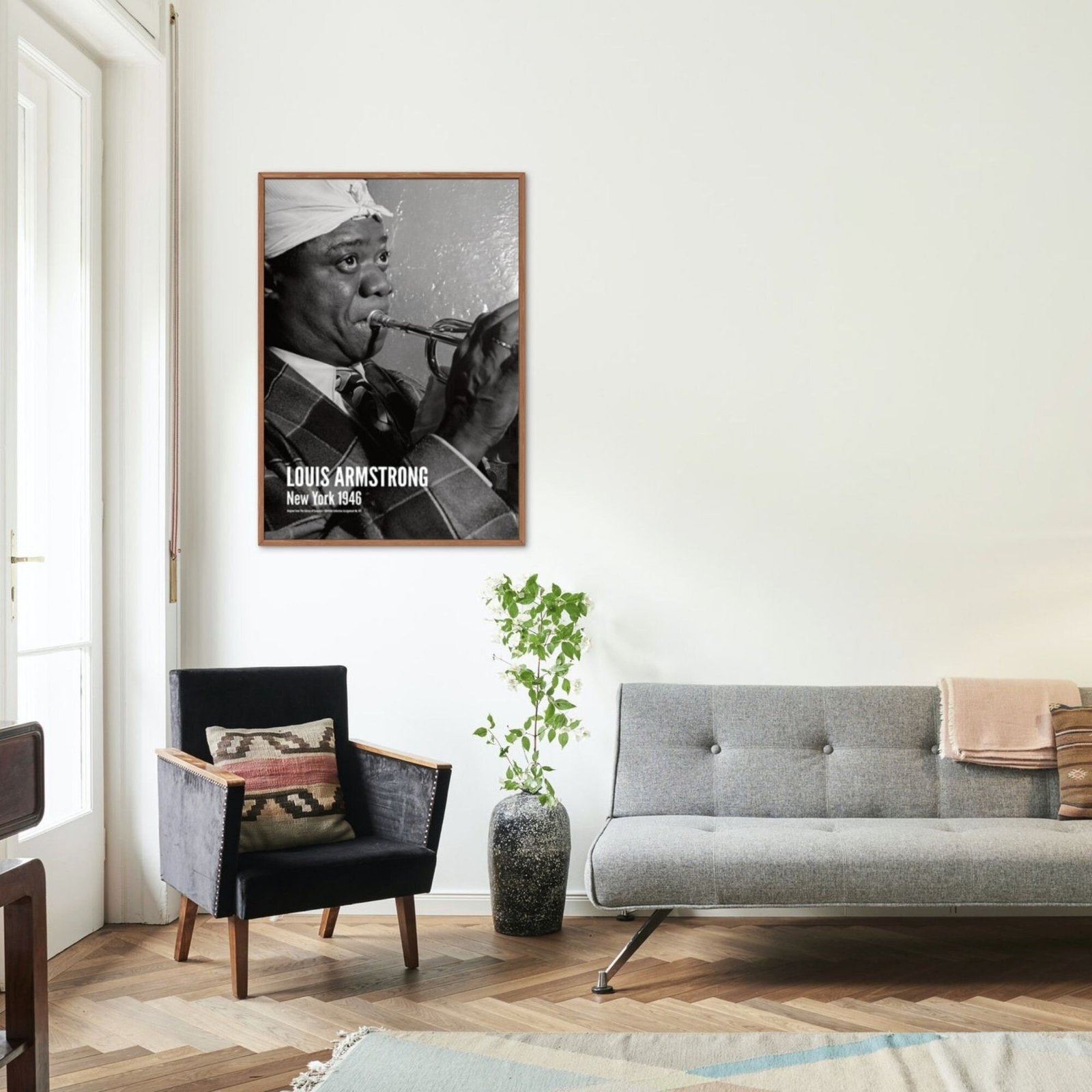 Modern living room with jazz musician poster.