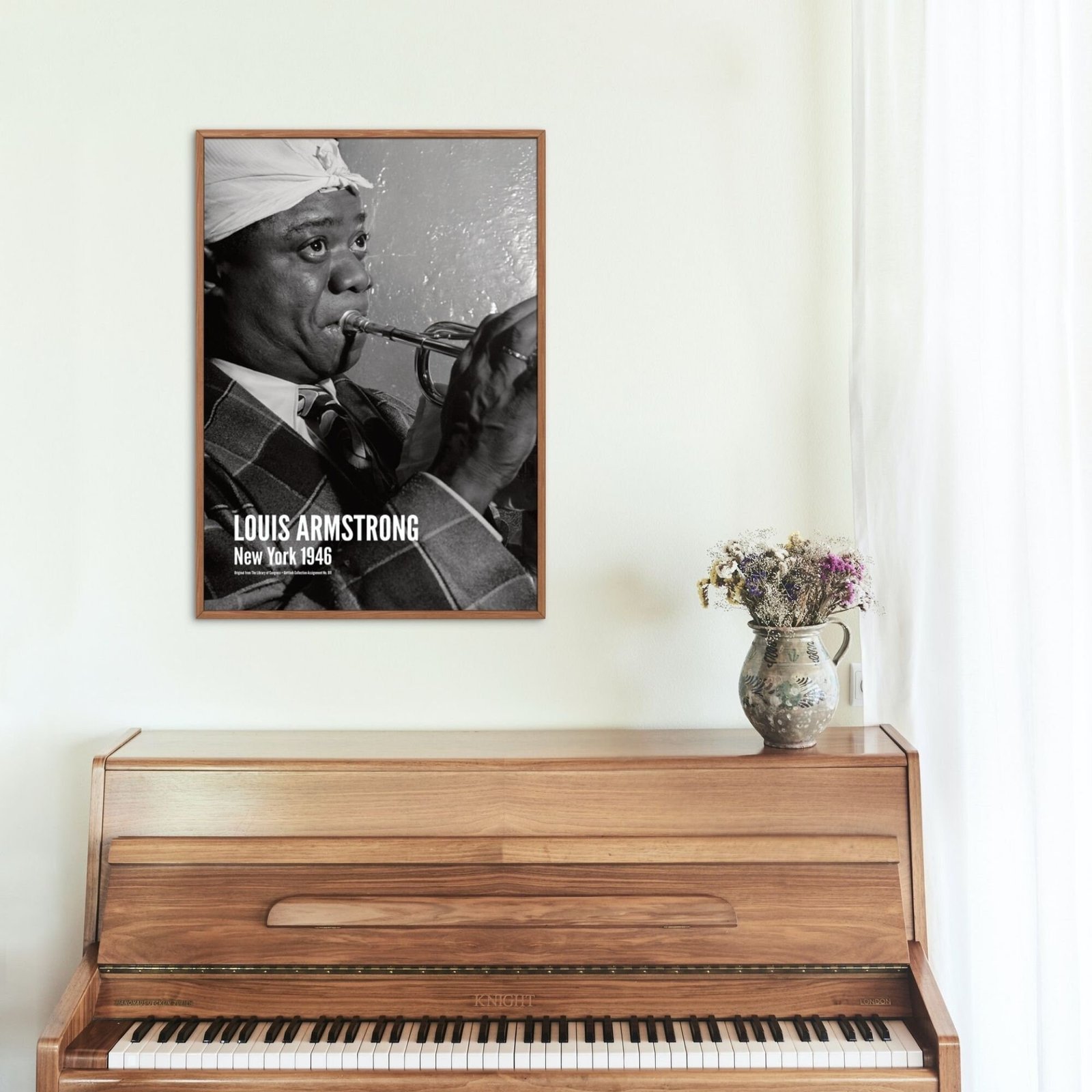 Black and white trumpet player portrait above piano.