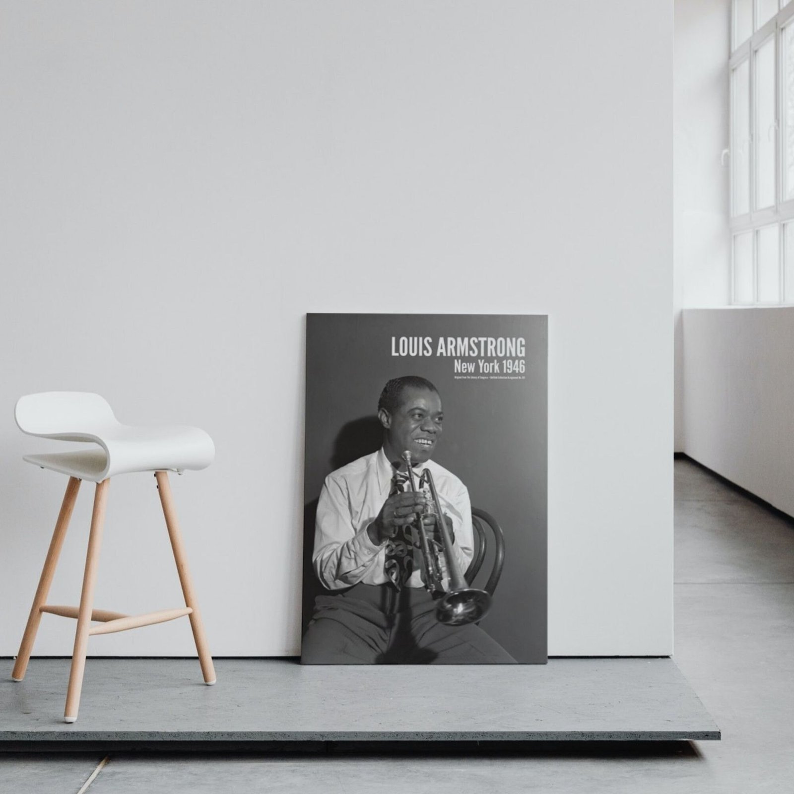 Poster of musician with trumpet beside white chair.