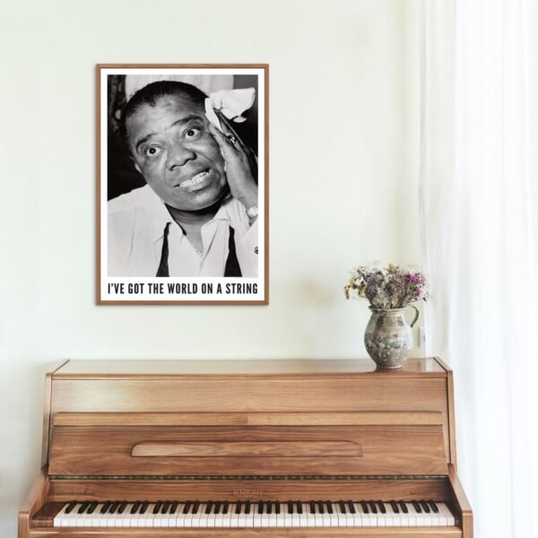 Black and white portrait above wooden piano