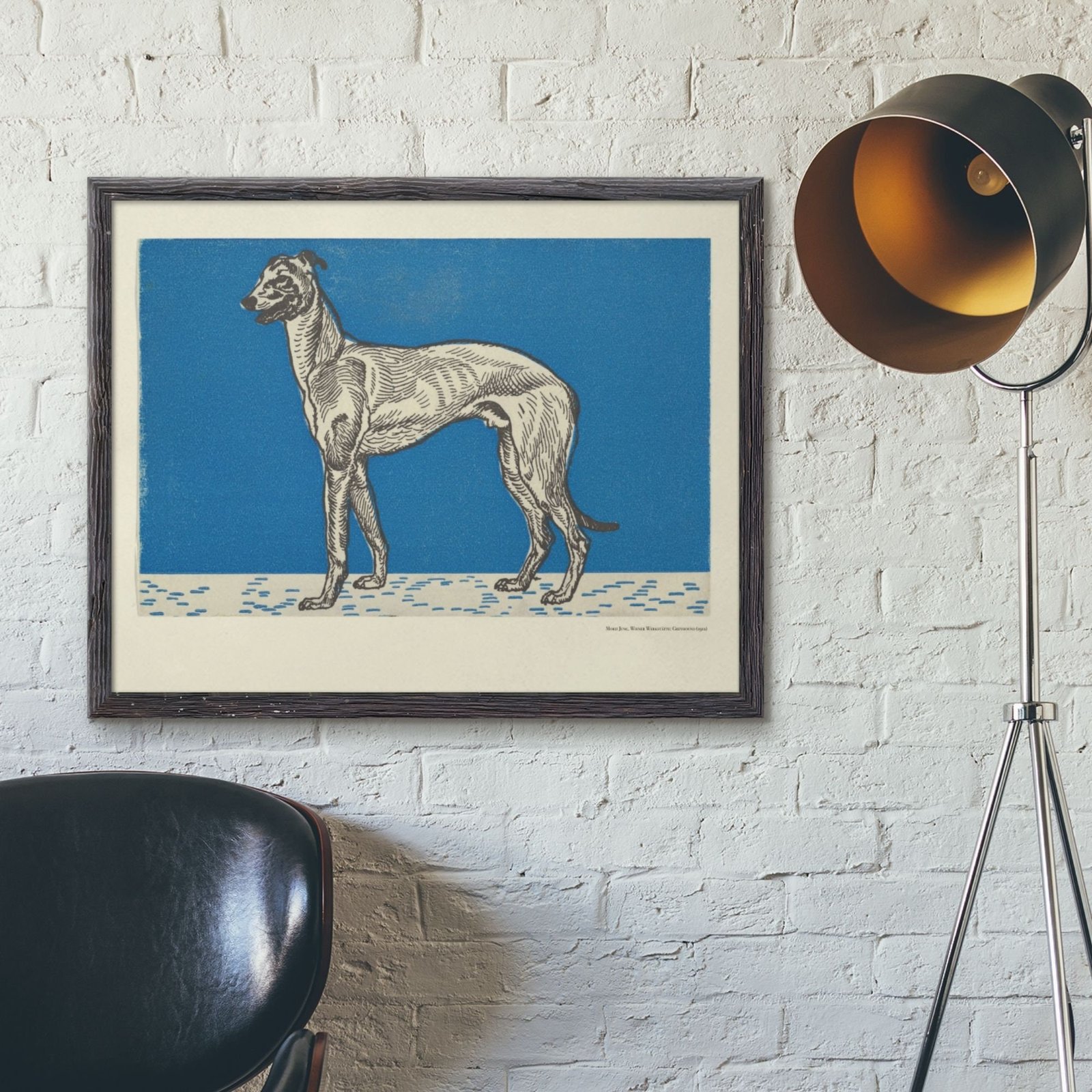 Framed dog artwork on white brick wall.