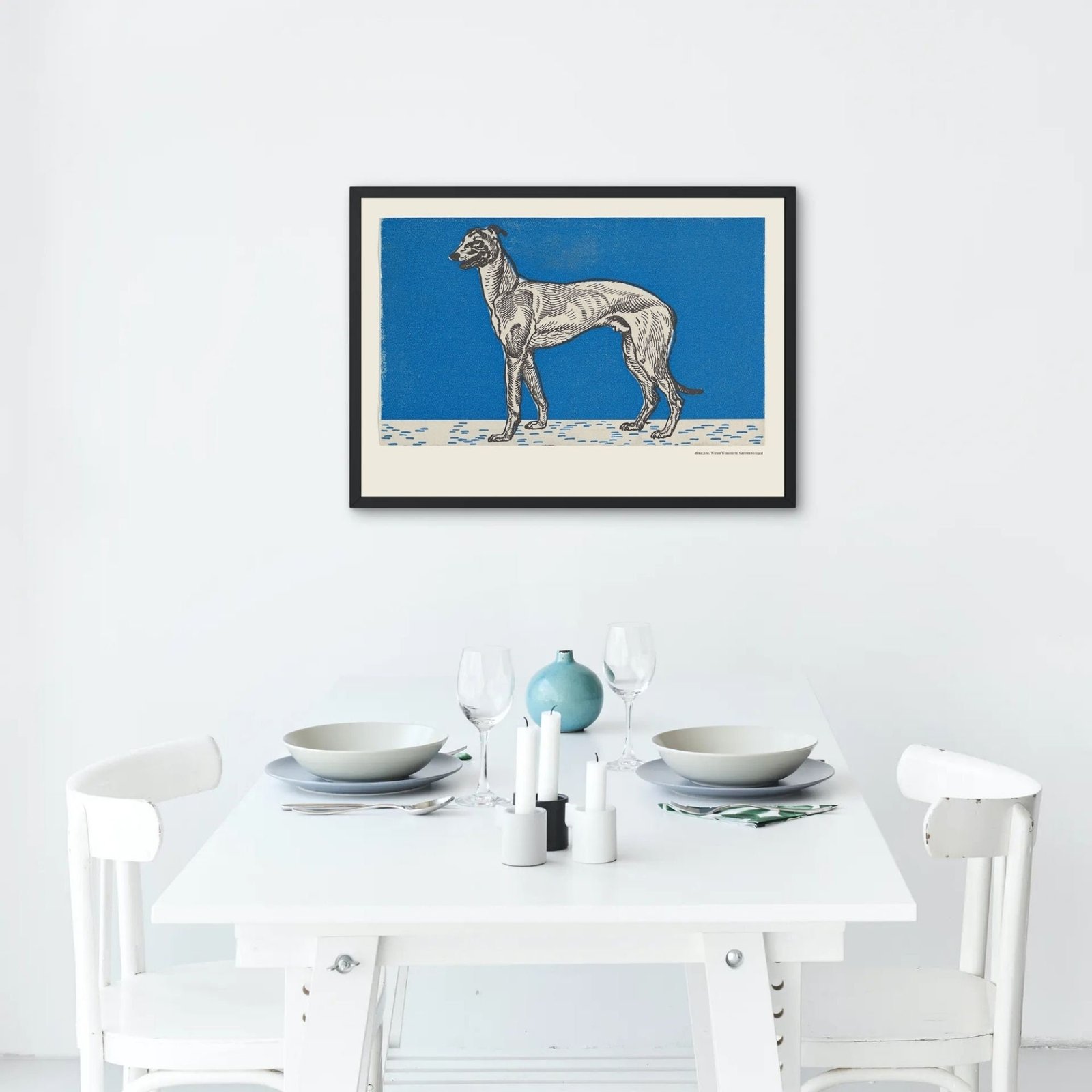 Framed dog artwork above minimalist dining table.