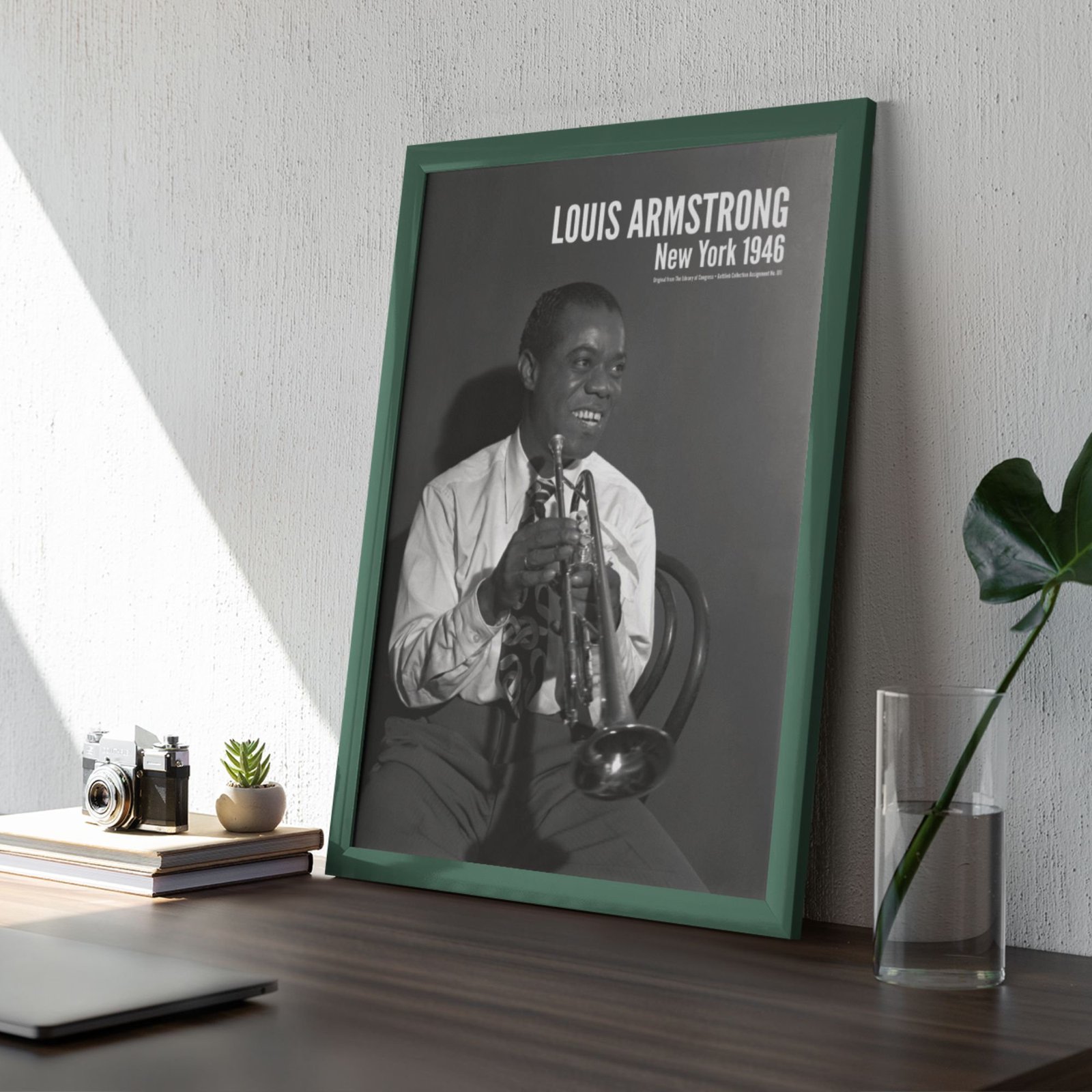 Framed black and white photo on a desk.