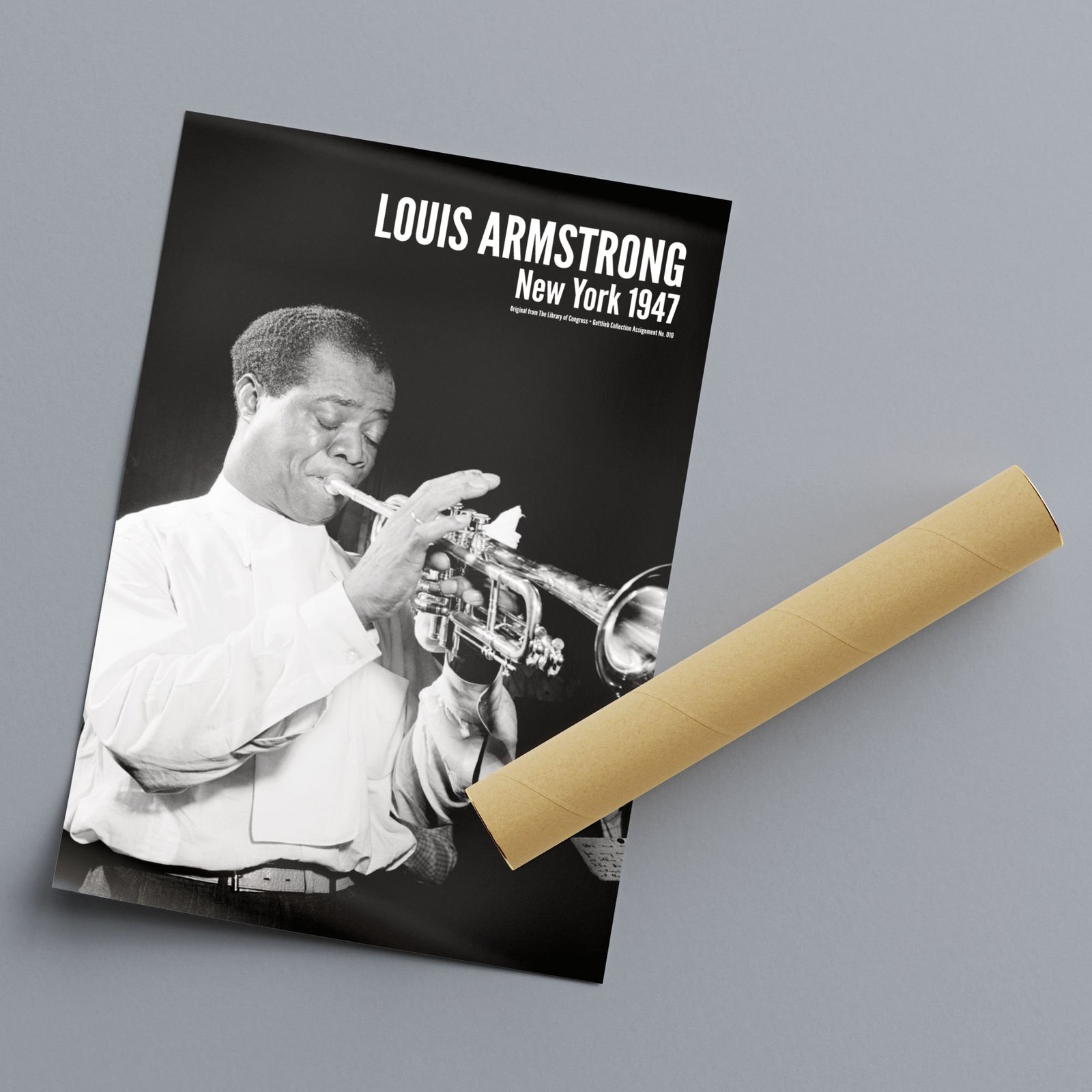 Louis Armstrong poster on gray surface.
