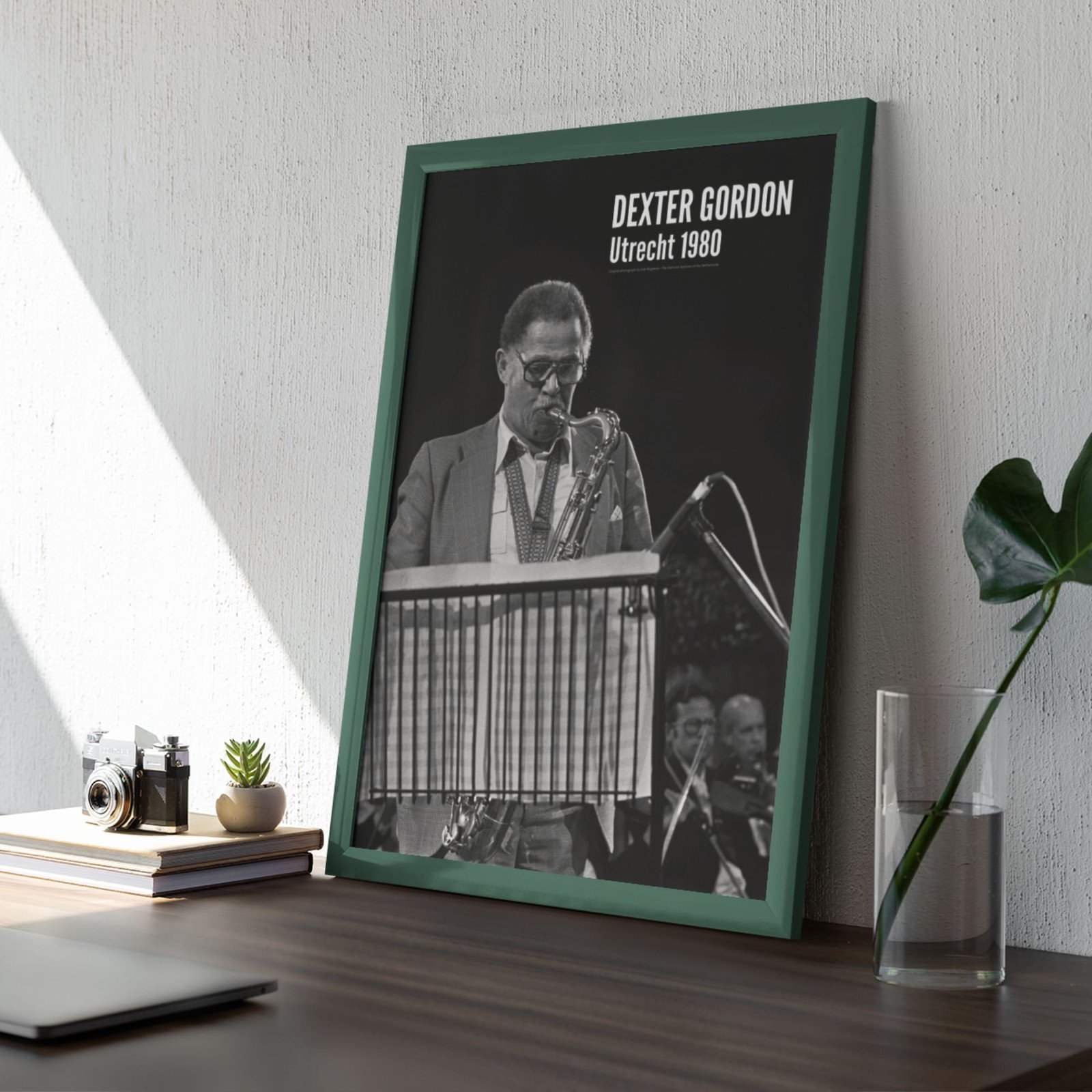 Framed saxophonist photo on wooden desk