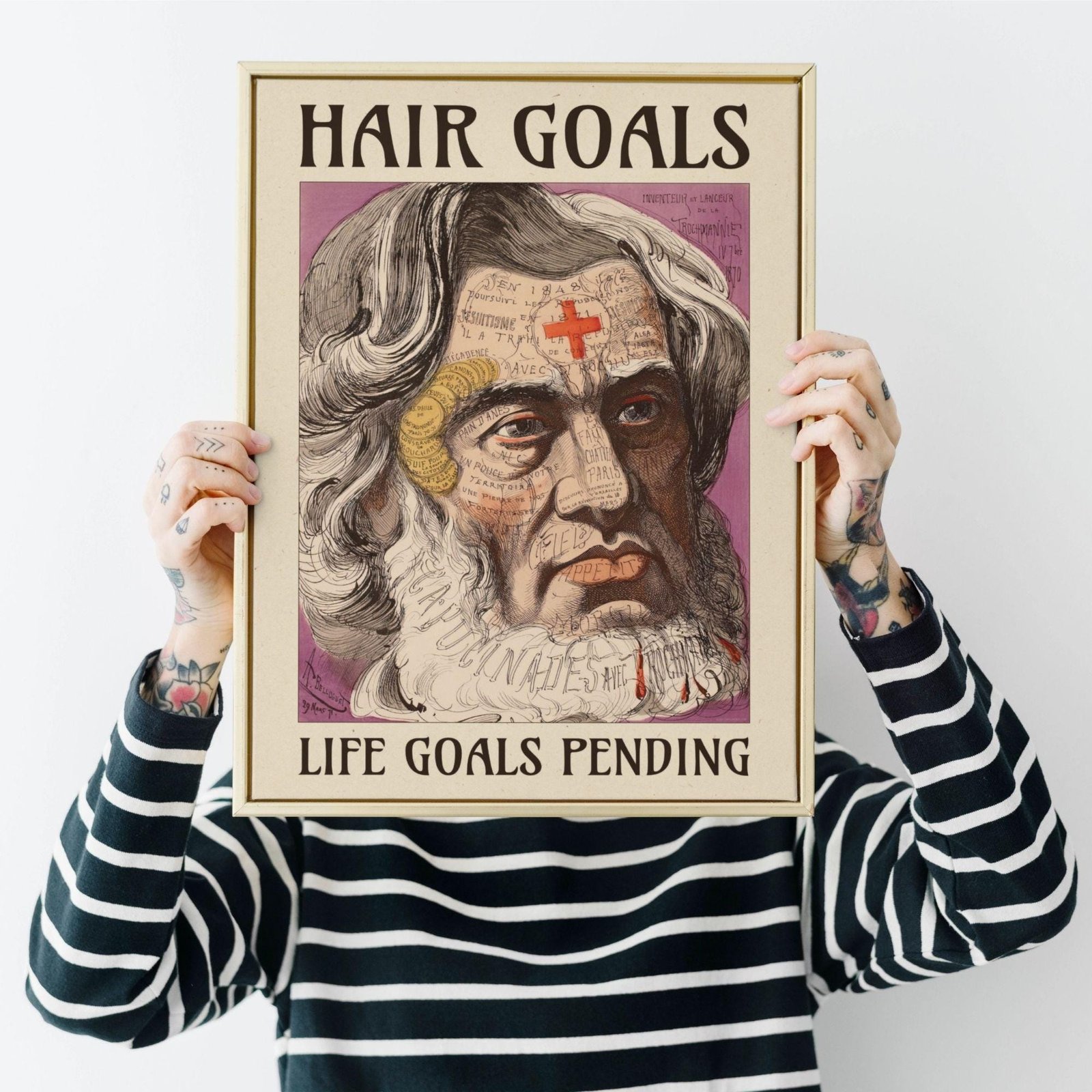 Person holding framed art with humorous text.