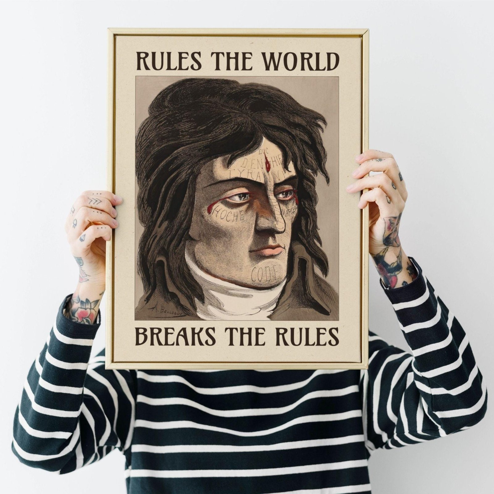 Framed portrait, 'Rules the World, Breaks the Rules'.