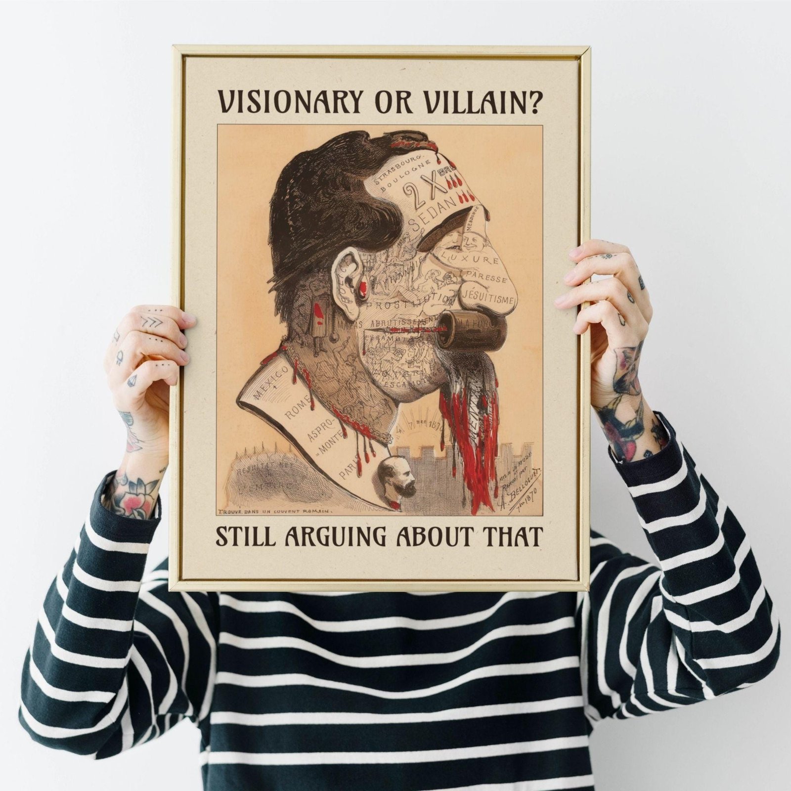 Person holding controversial portrait with text.
