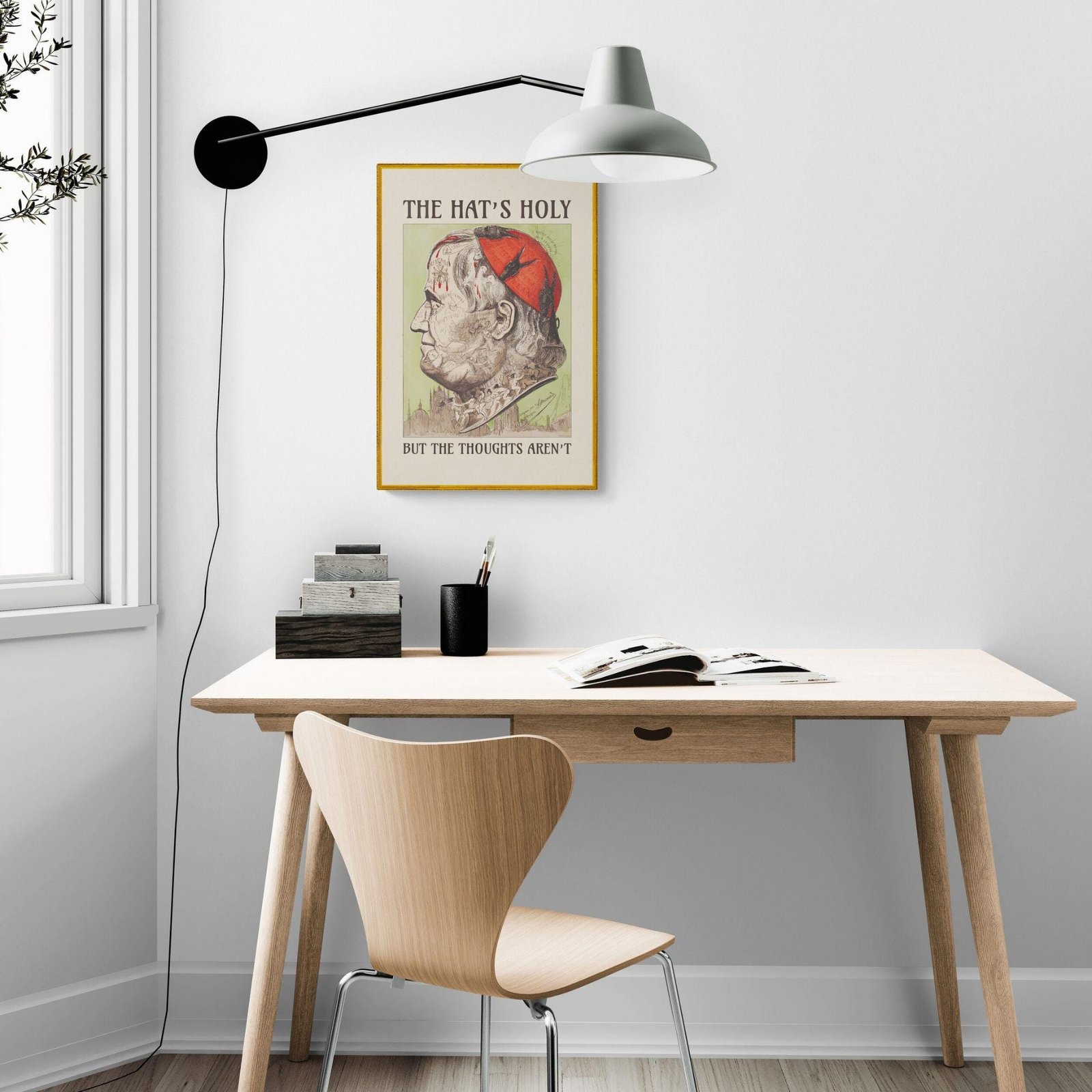 Modern home office with humorous wall art.
