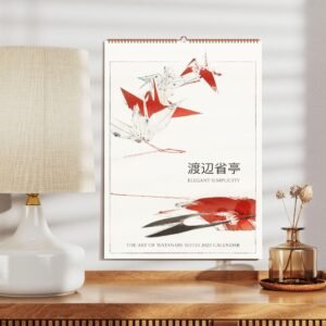 2025 Watanabe Seitei calendar on wooden desk.