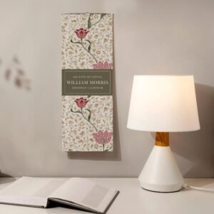 Decorative floral calendar and lamp on desk