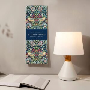 William Morris birthday calendar beside lamp on table.