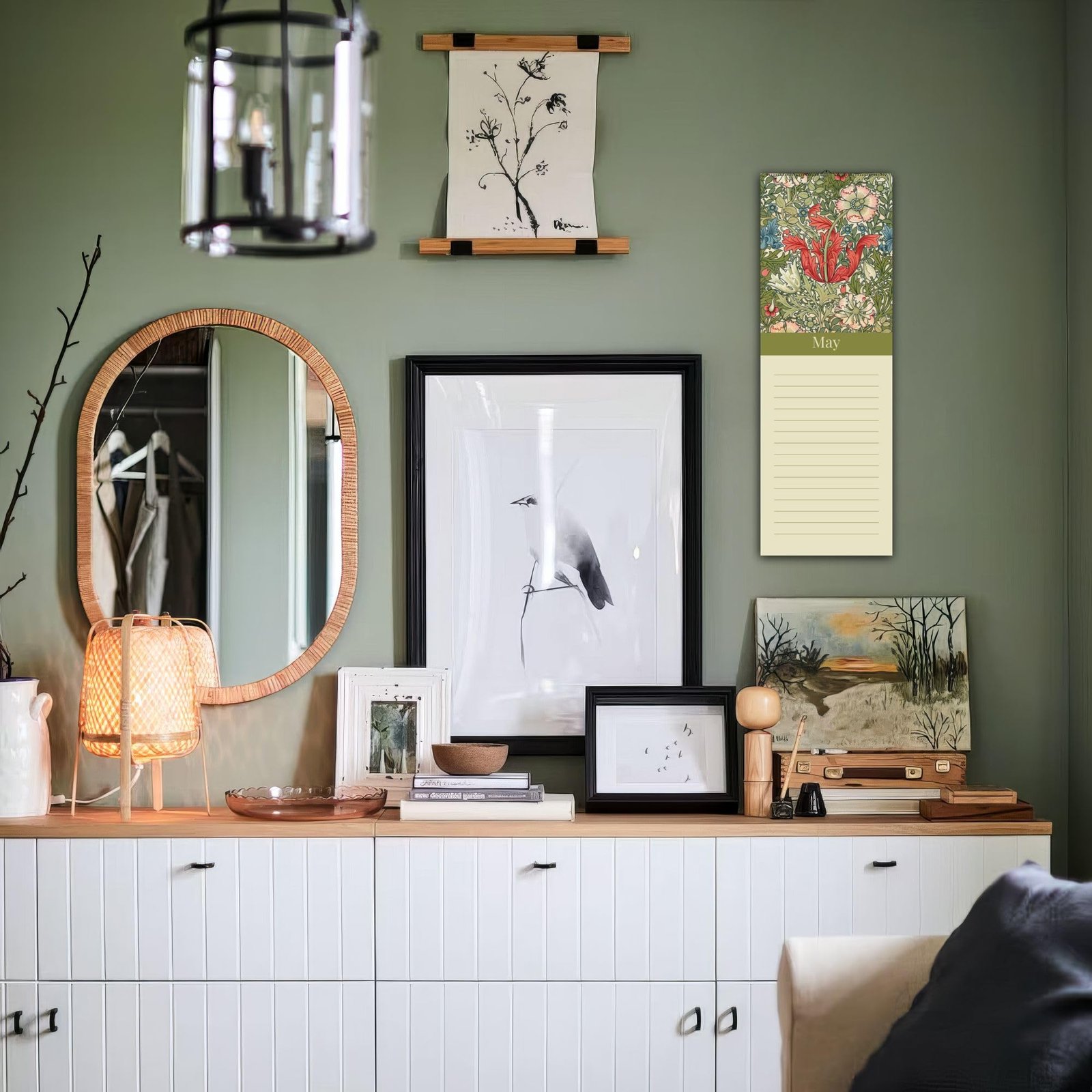 Cozy room with art, mirror, and sideboard decor.