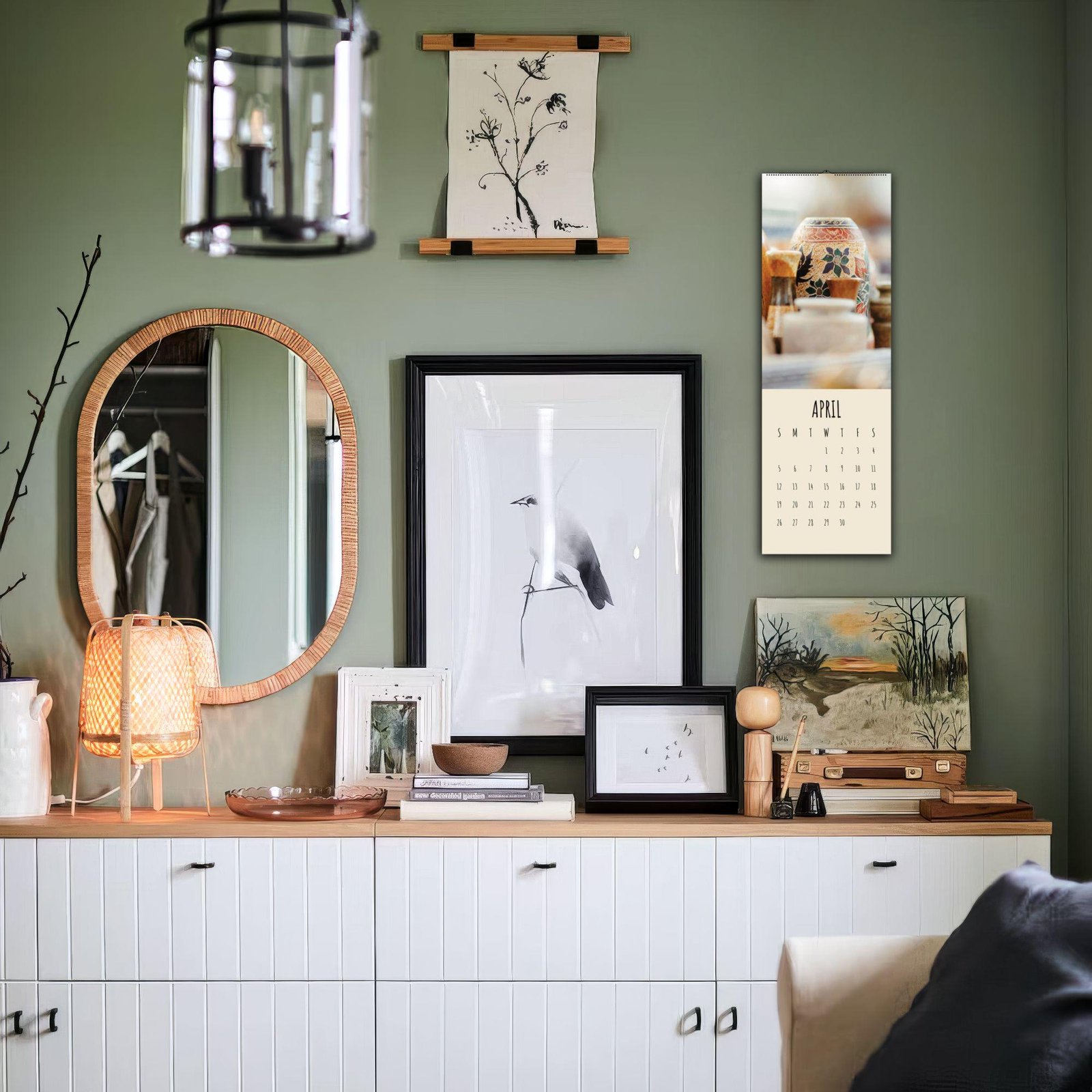 Stylish living room wall with art and calendar.