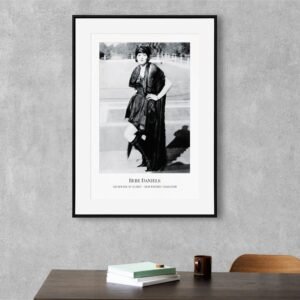 Framed vintage photograph on modern gray wall.