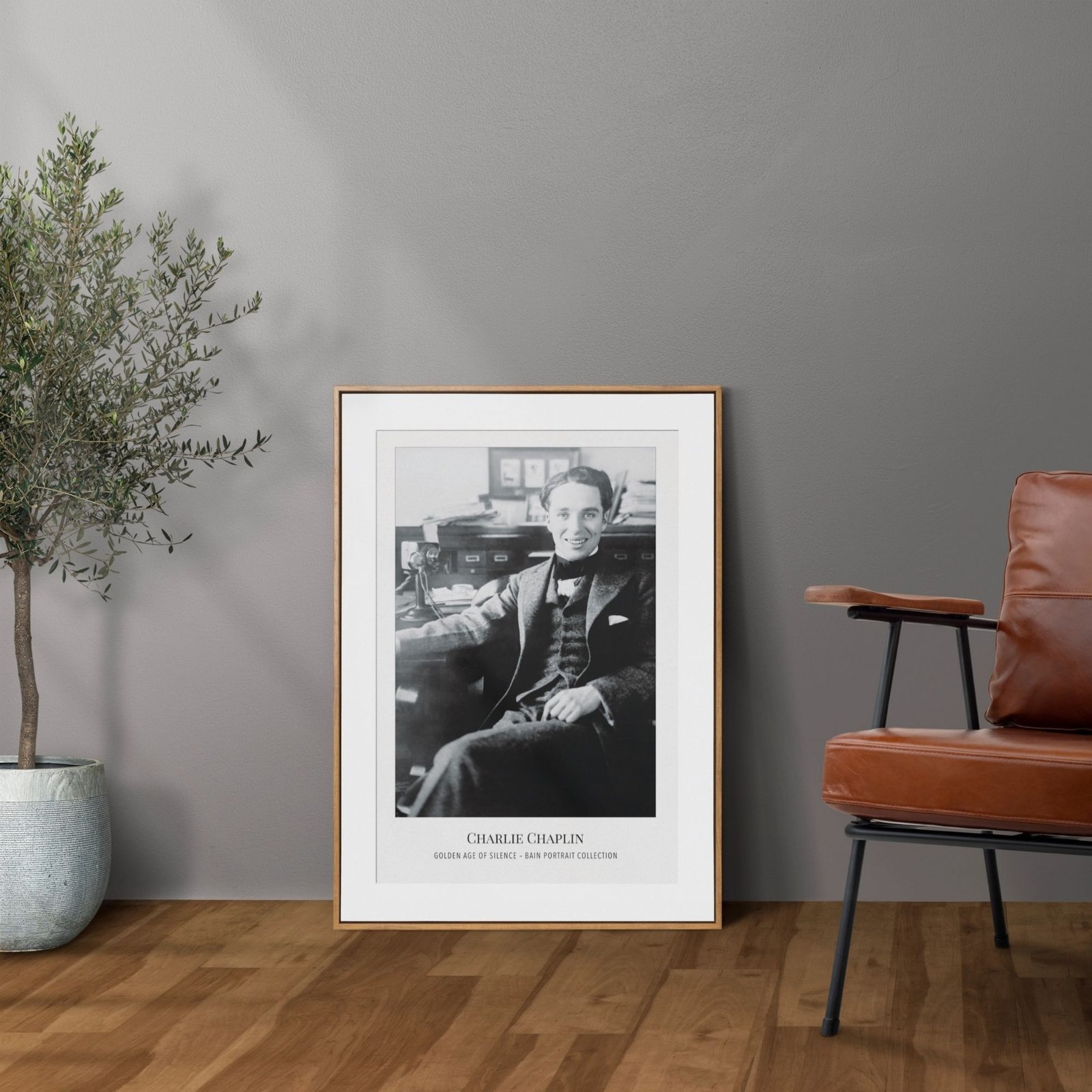 Framed black and white portrait in modern room decor.