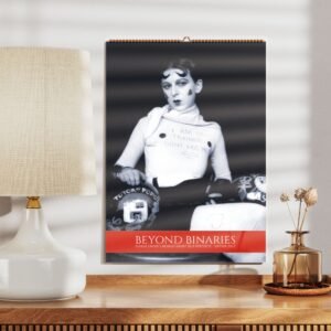 Artistic black-and-white poster on a wooden shelf.