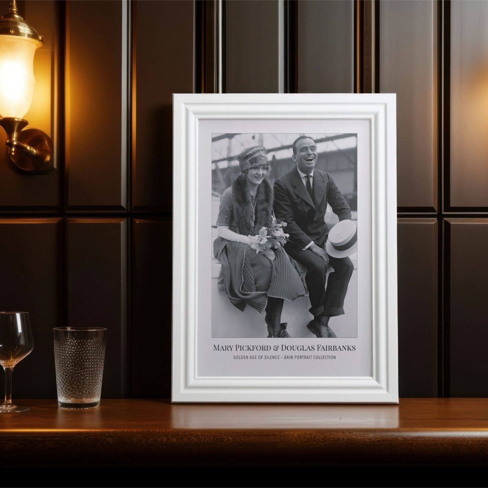 Framed black and white photo of smiling couple.
