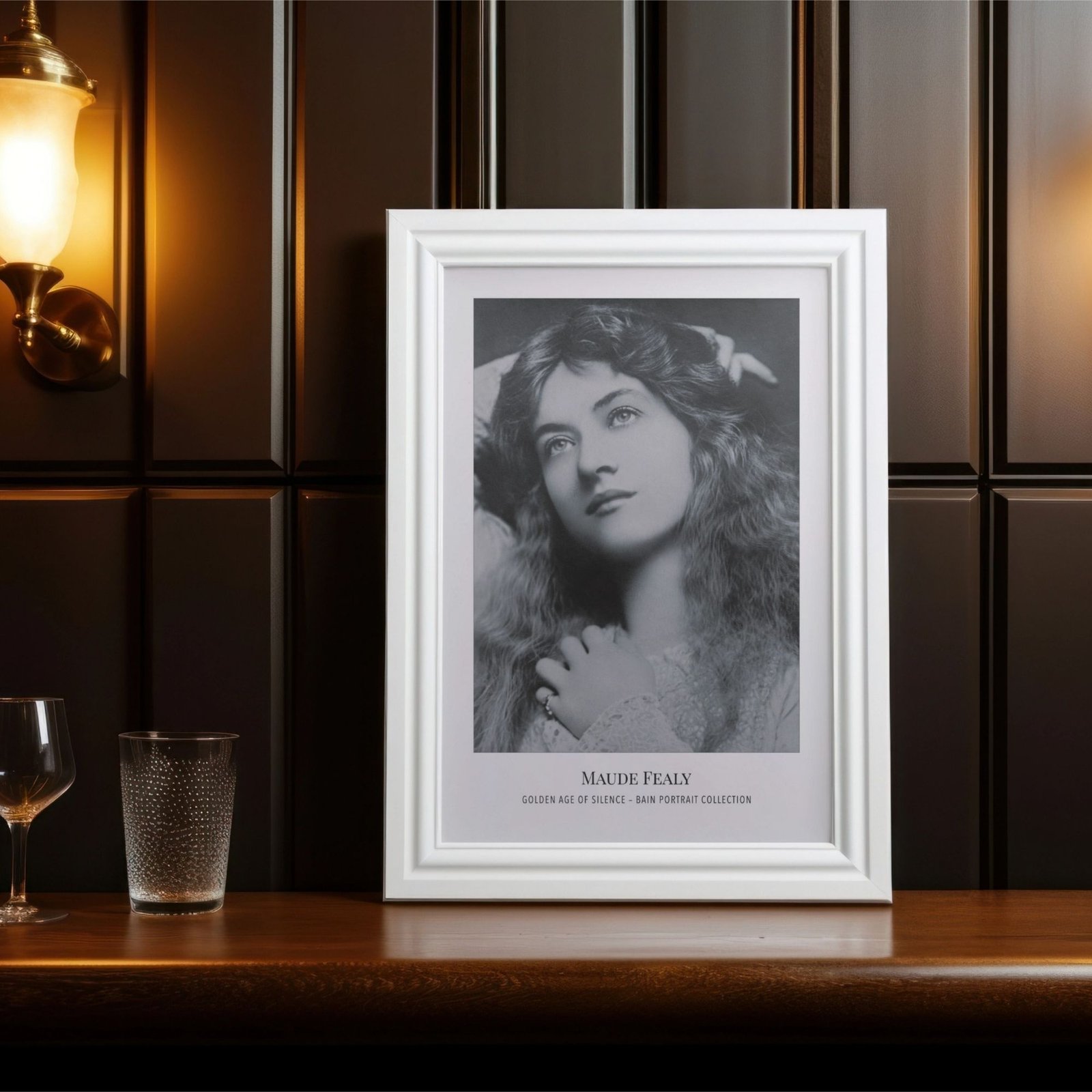 Framed vintage portrait on wooden shelf with glassware.