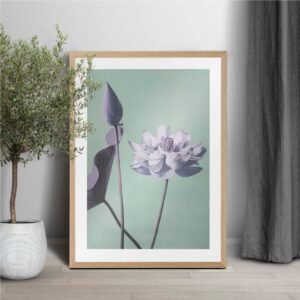 Framed lotus artwork near potted plant