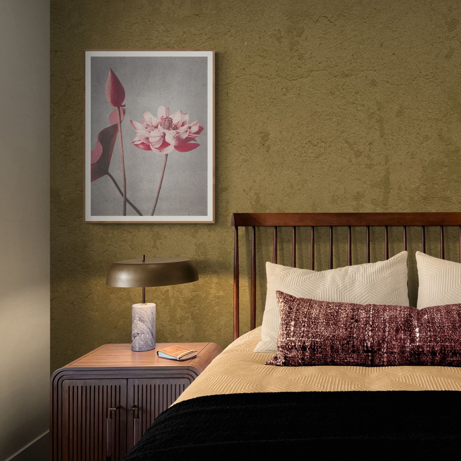 Bedroom with framed flower art and nightstand lamp.