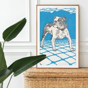 Framed dog illustration on modern wicker dresser.
